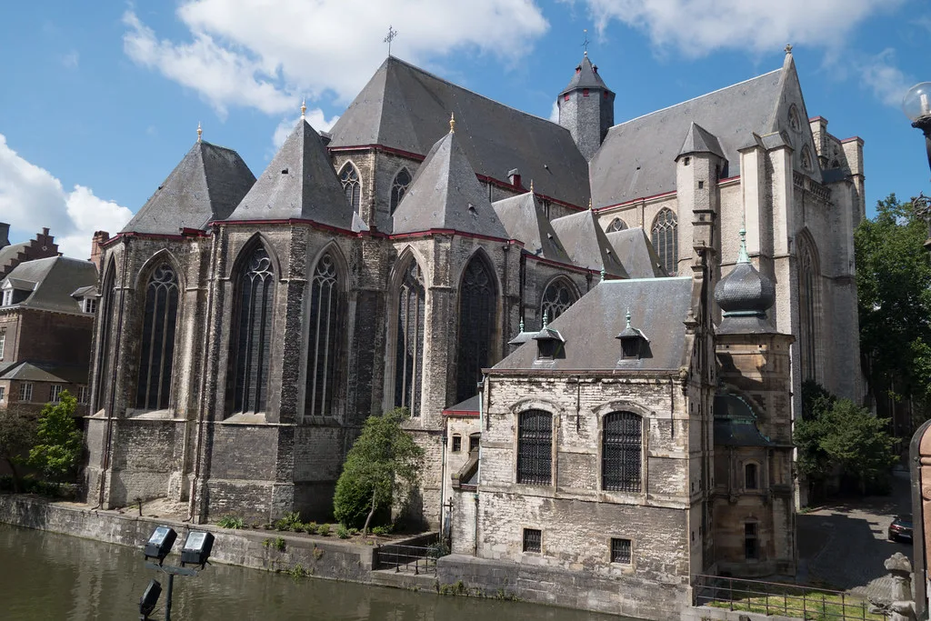 A large Gothic church beside the Leie river in central Ghent.