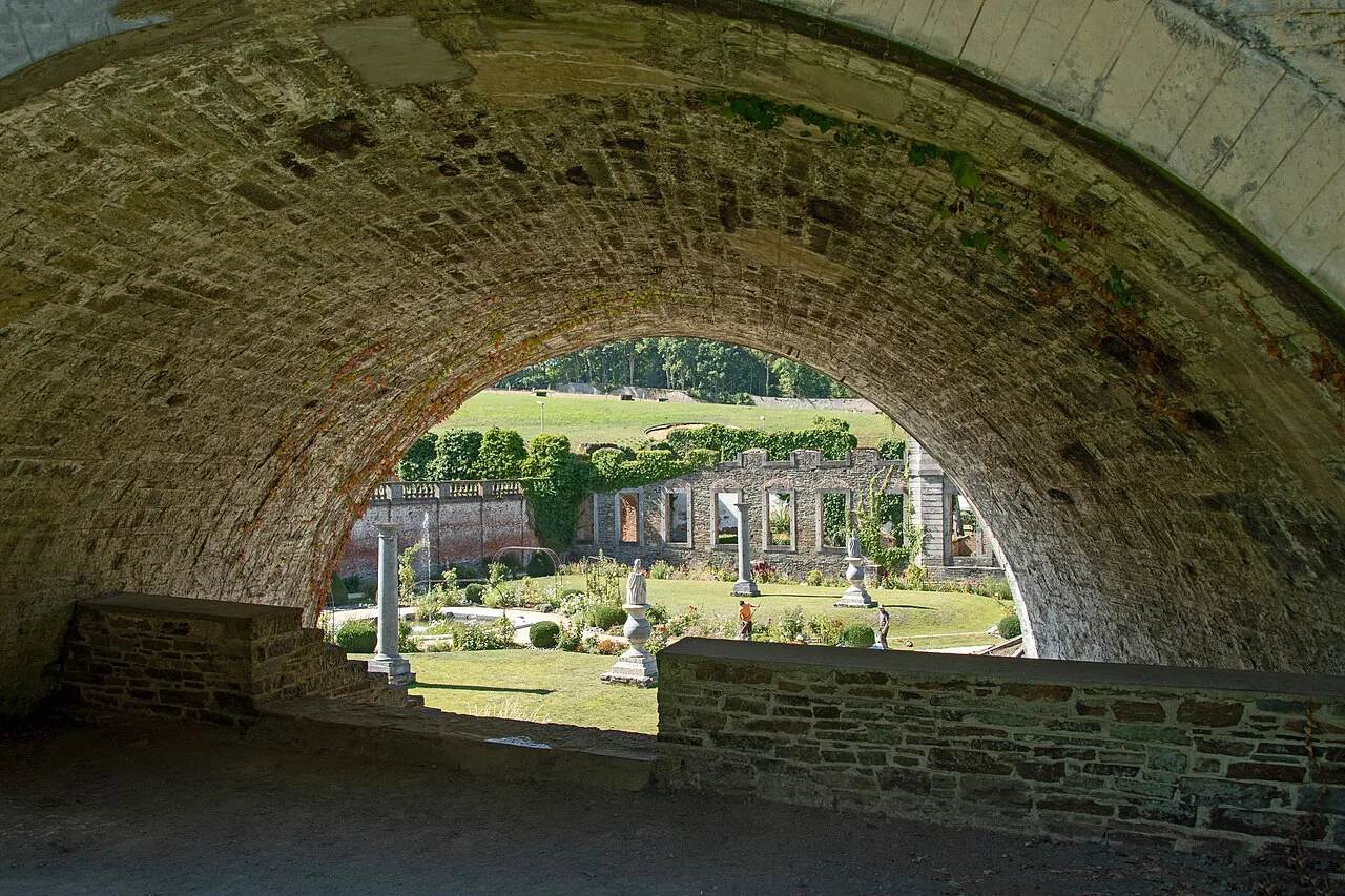 The ruins of Villers Abbey seen through a stone archway, Villers-la-Ville.