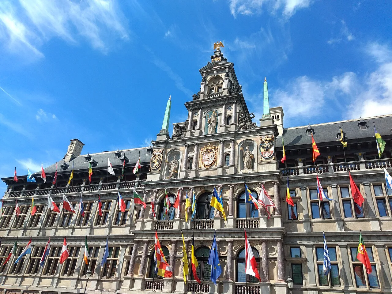 The flag-hung City Hall on the Grote Markt, Antwerp.