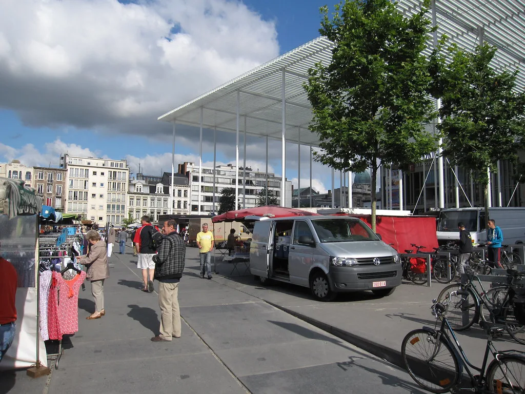 Market stalls under the canopy on the square by the Stadsschouwburg in Antwerp.