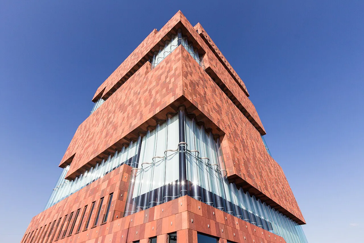 The stacked red stone tower of the MAS museum in Antwerp's Eilandje district.