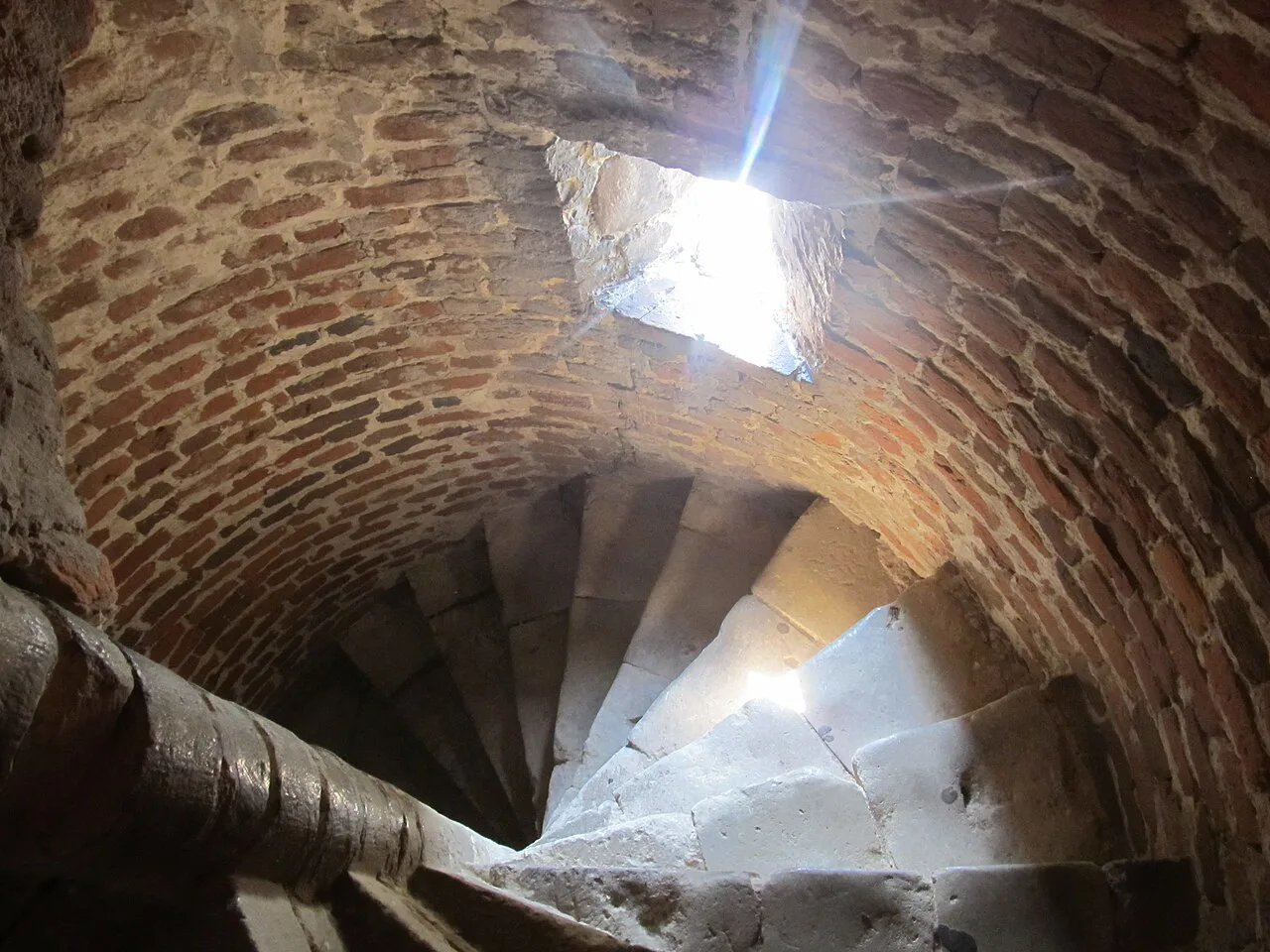 A brick spiral staircase inside Beersel Castle.