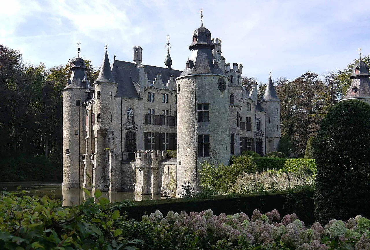 Borrekens Castle seen across its flower-filled gardens, Vorselaar.