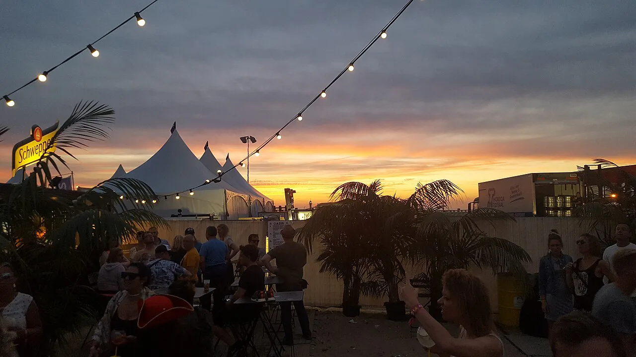 A summer beach festival at sunset in Ostend.