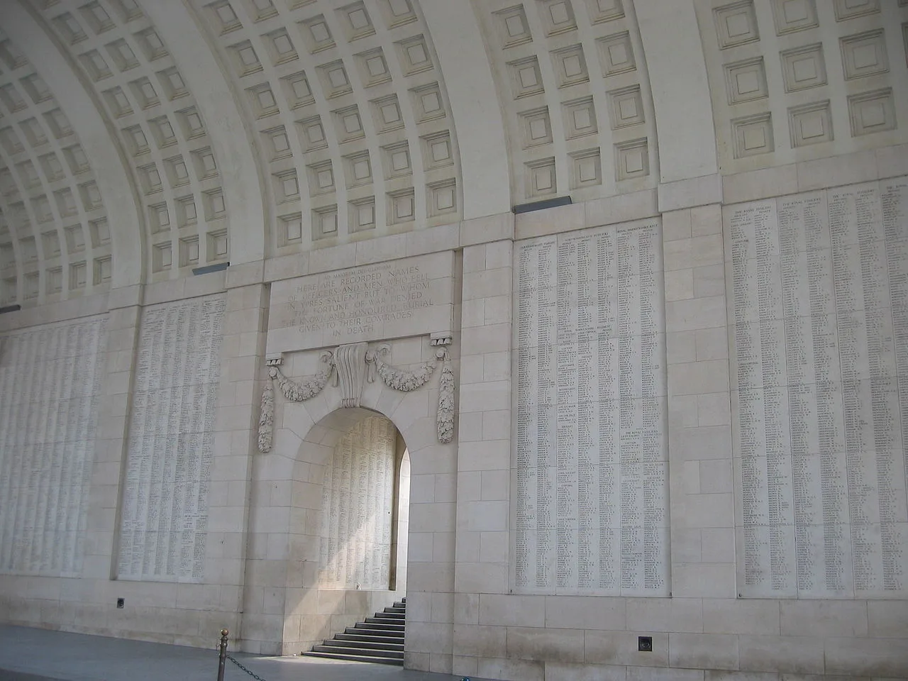 The arched interior of the Menin Gate in Ypres, lined with memorial panels.