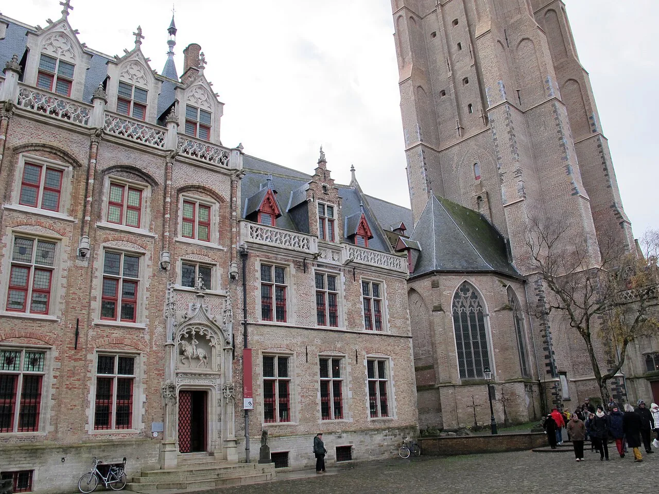 The facade of the Gruuthuse Museum beside the tower of the Church of Our Lady, Bruges.