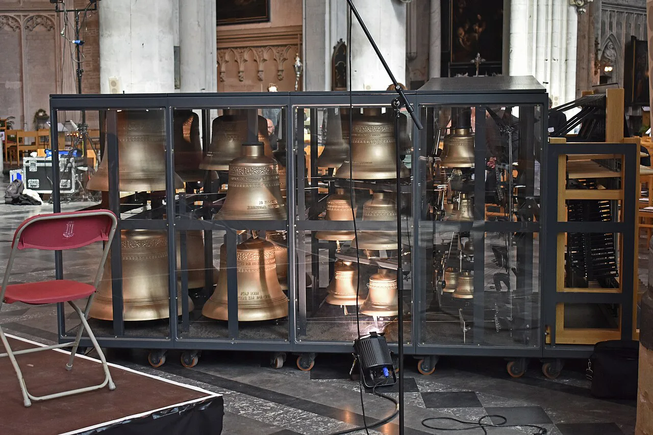 Carillon bells on display inside St Rumbold's Cathedral in Mechelen.