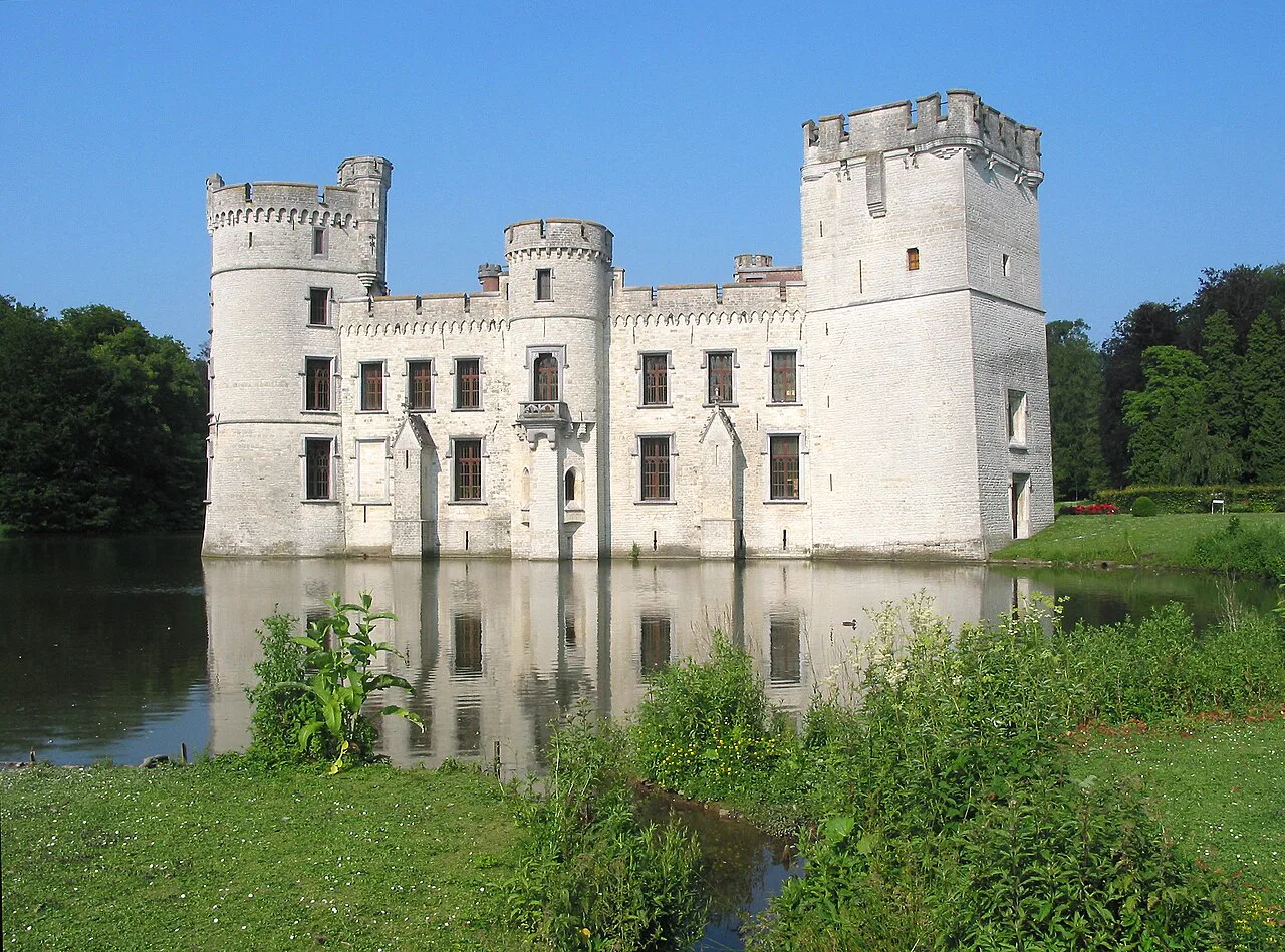 Bouchout Castle reflected in the water of its pond, Meise.