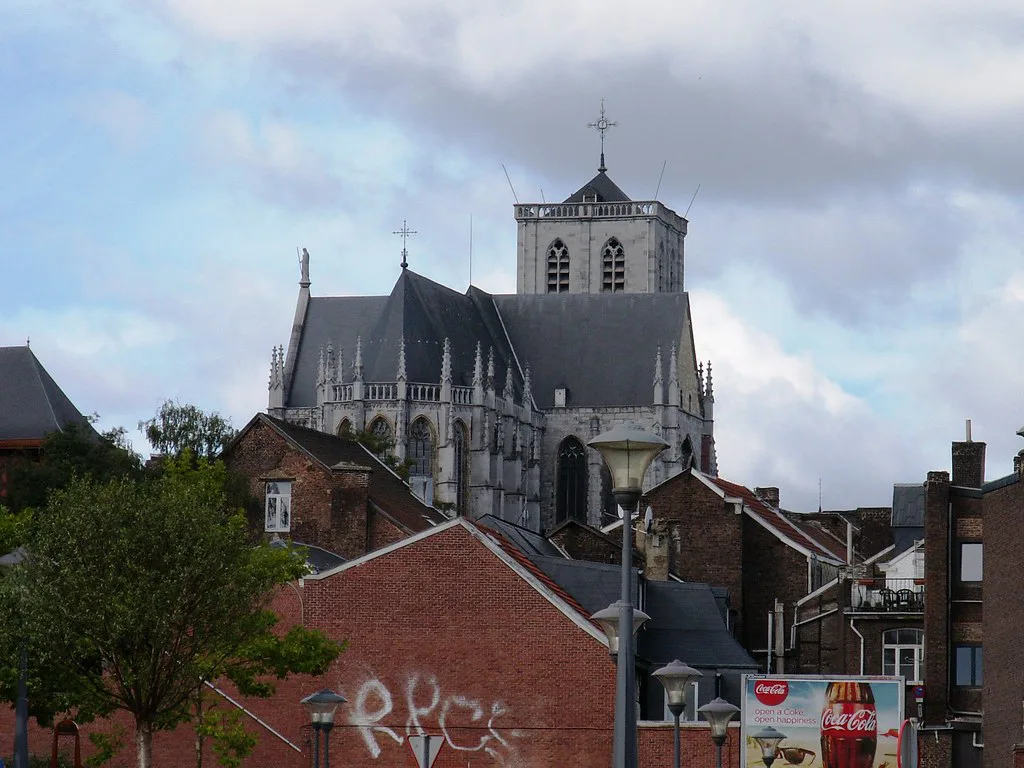 A church rising above the rooftops of Liège.