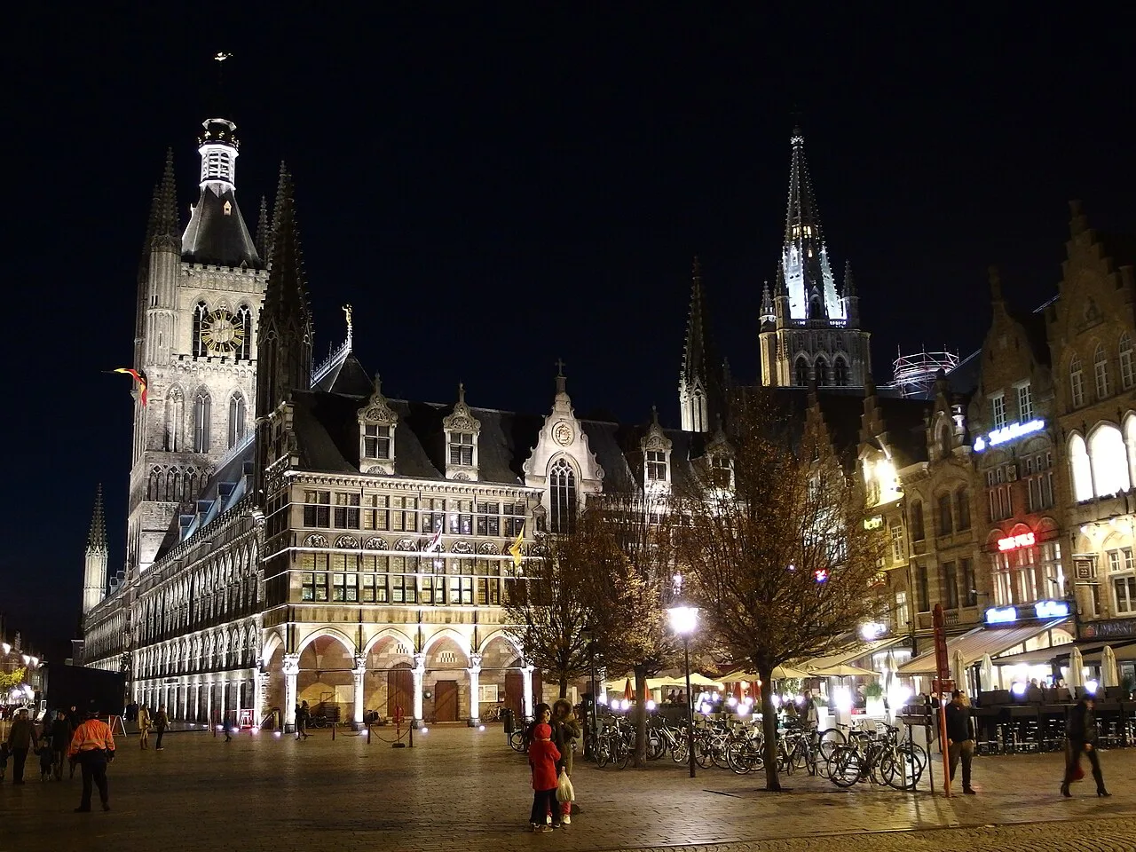 The Grote Markt and Cloth Hall lit up at night in Ypres.