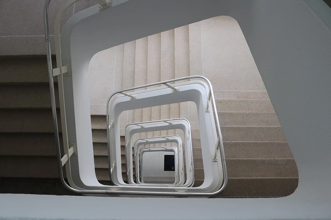 A spiral staircase inside the Cité Miroir, Liège.