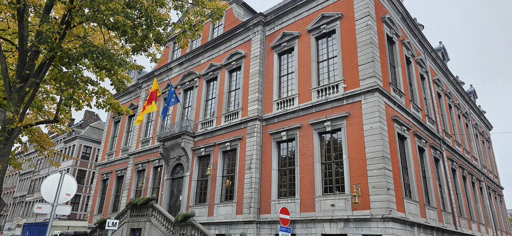 A red-brick civic building in central Liège.