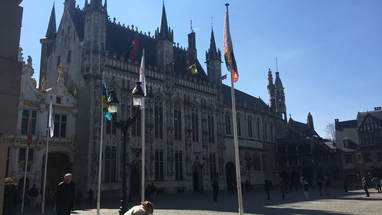 Gothic buildings on a square in central Bruges.