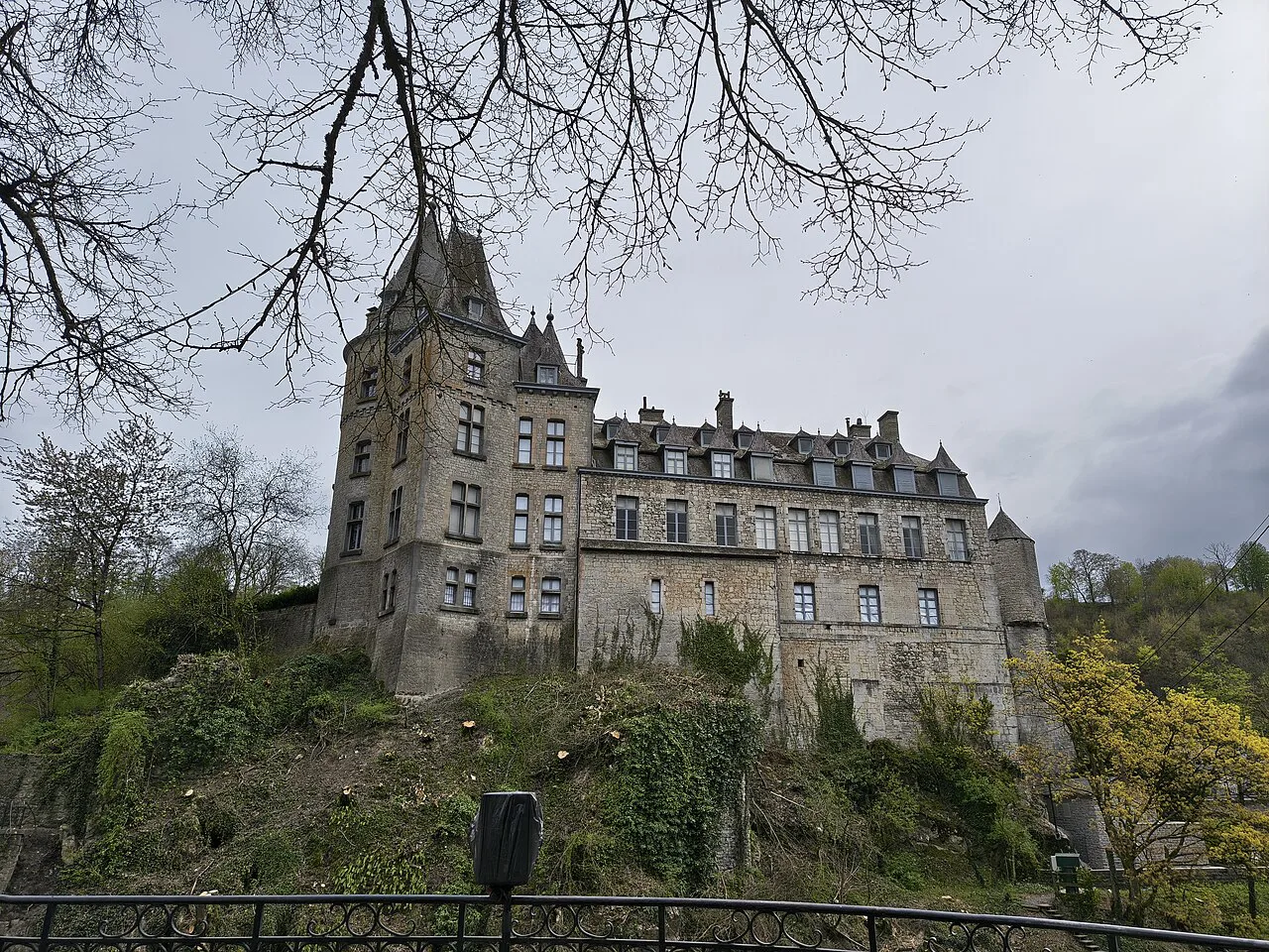 Durbuy Castle above the town on a wooded hillside.