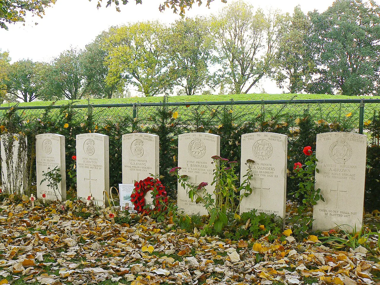 Special memorial headstones with wreaths at Essex Farm Cemetery, near Ypres.