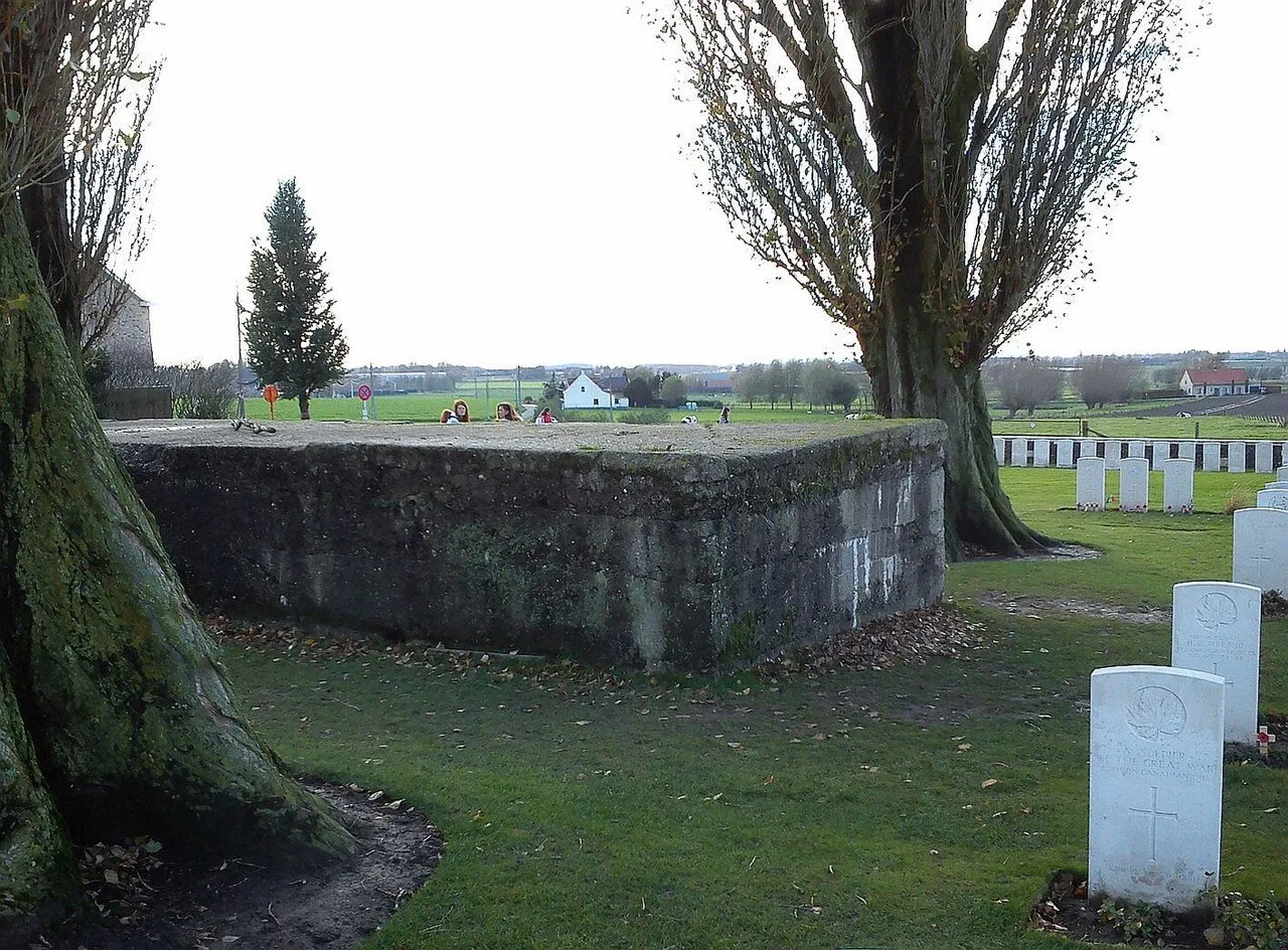 A German concrete pillbox among the graves at Tyne Cot Cemetery.
