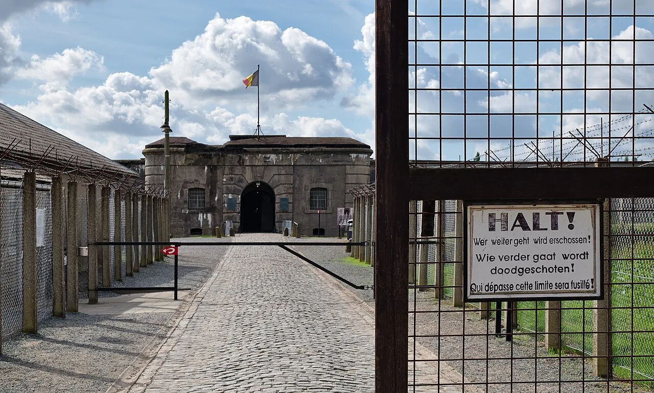 The entrance to Fort Breendonk seen through the barbed-wire fence.