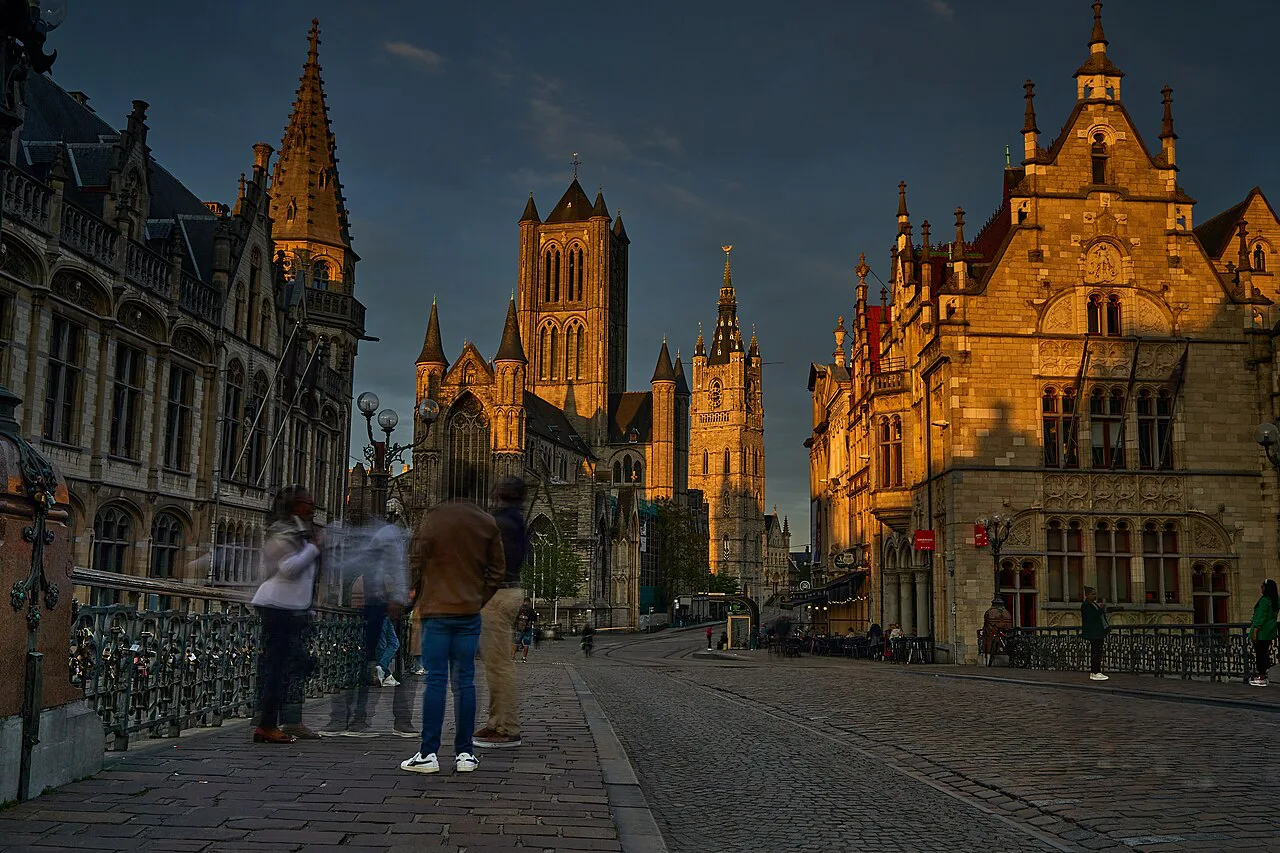 The towers of Ghent at dusk seen from St Michael's Bridge.