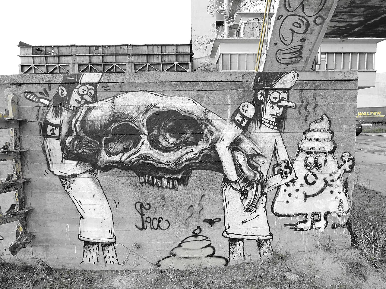 A large skull mural on a street-art wall in Ghent.