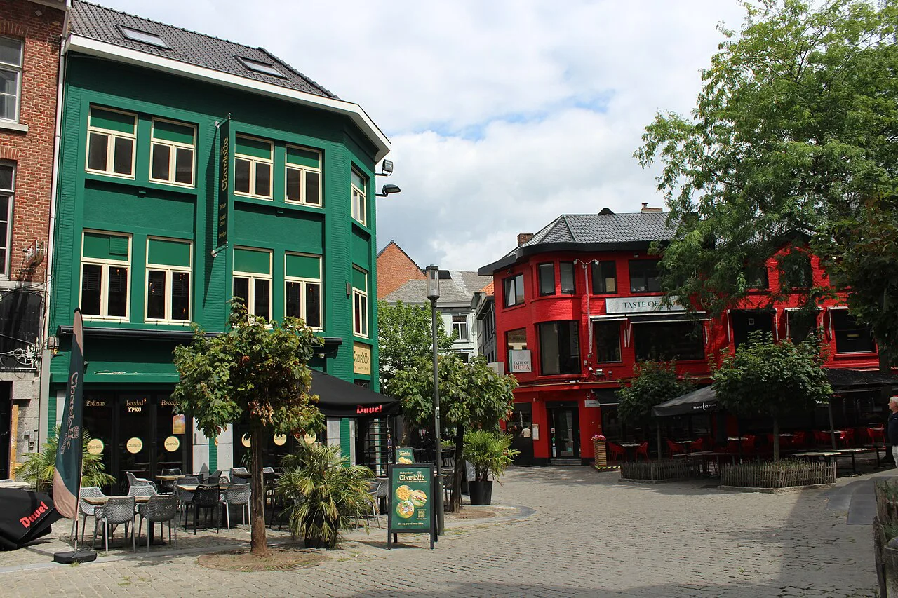Colourful houses and cafe terraces on a square in Hasselt.
