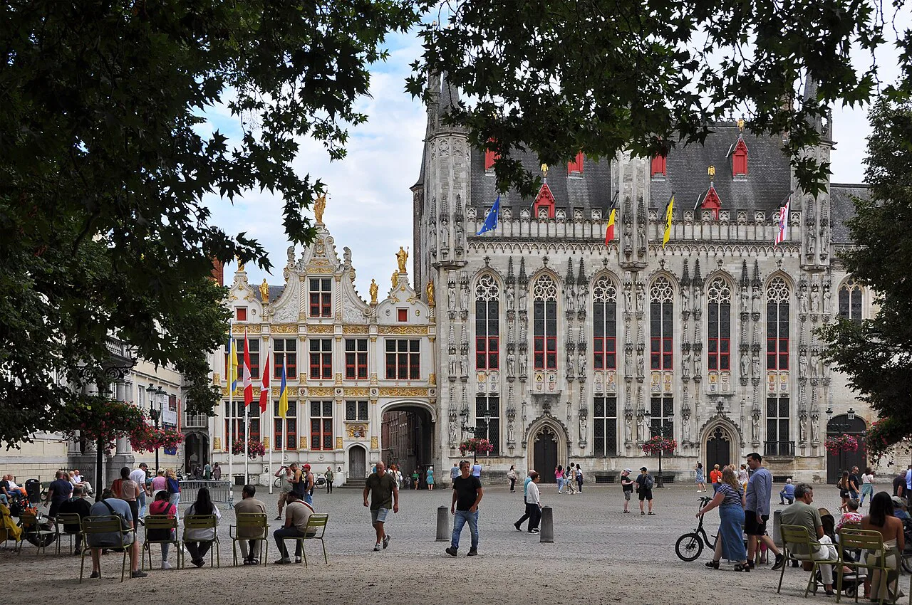 Café terraces and visitors on the Burg square, Bruges.