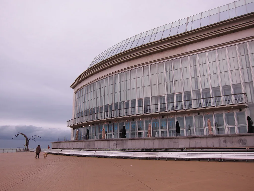 The curved glass frontage of the Kursaal on the seafront in Ostend.