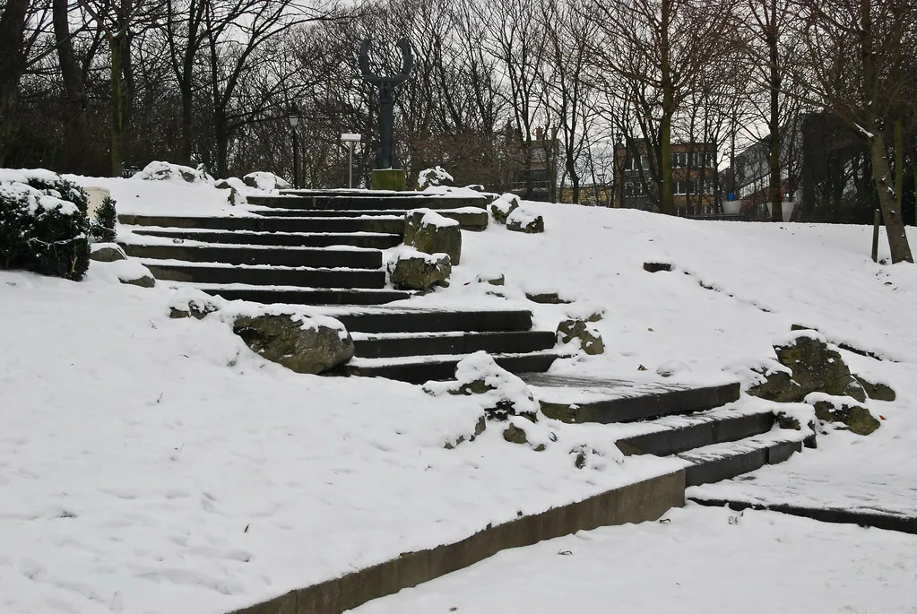 Stone steps under snow in Leopold Park, Ostend.