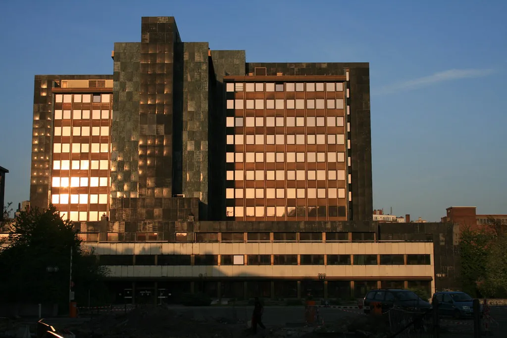 The Finance Tower in Liège lit by the evening sun.