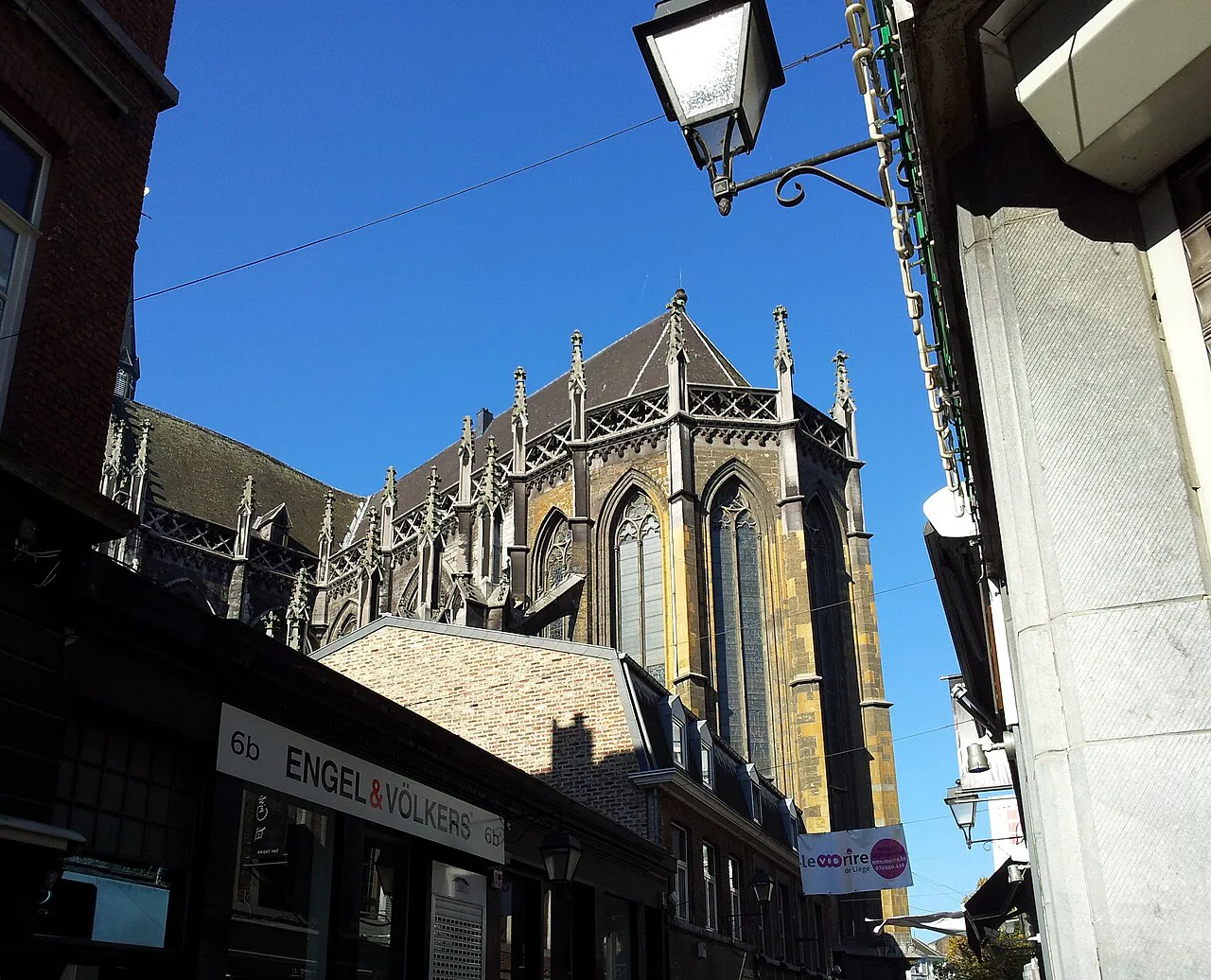 The Gothic choir of St Paul's Cathedral seen from a street in Liège.