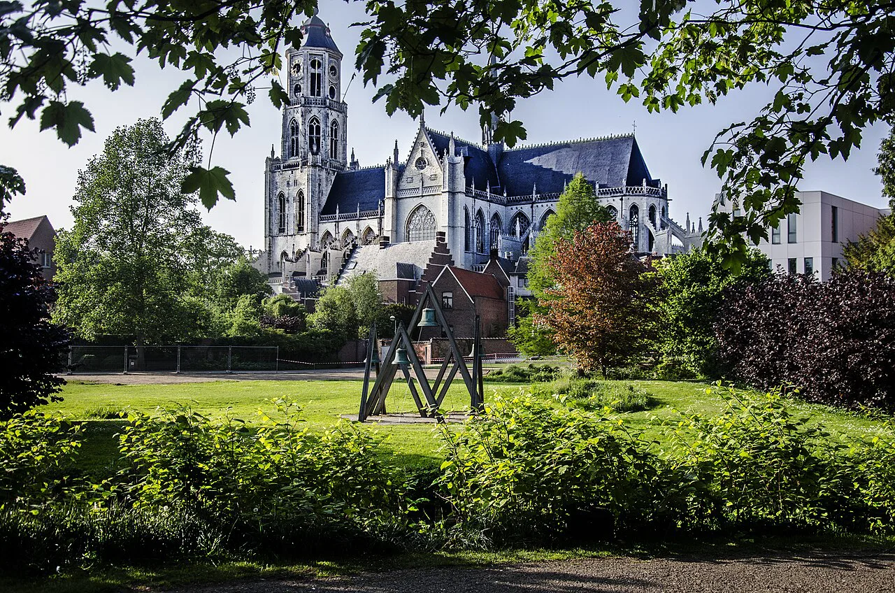 St Gummarus Collegiate Church rising above a small park, Lier.