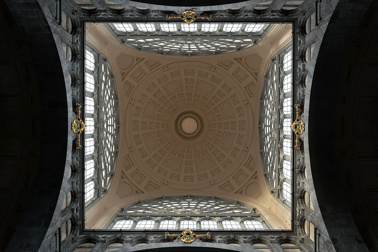 Looking up into the domed ceiling of the entrance hall at Antwerpen-Centraal station in Antwerp.