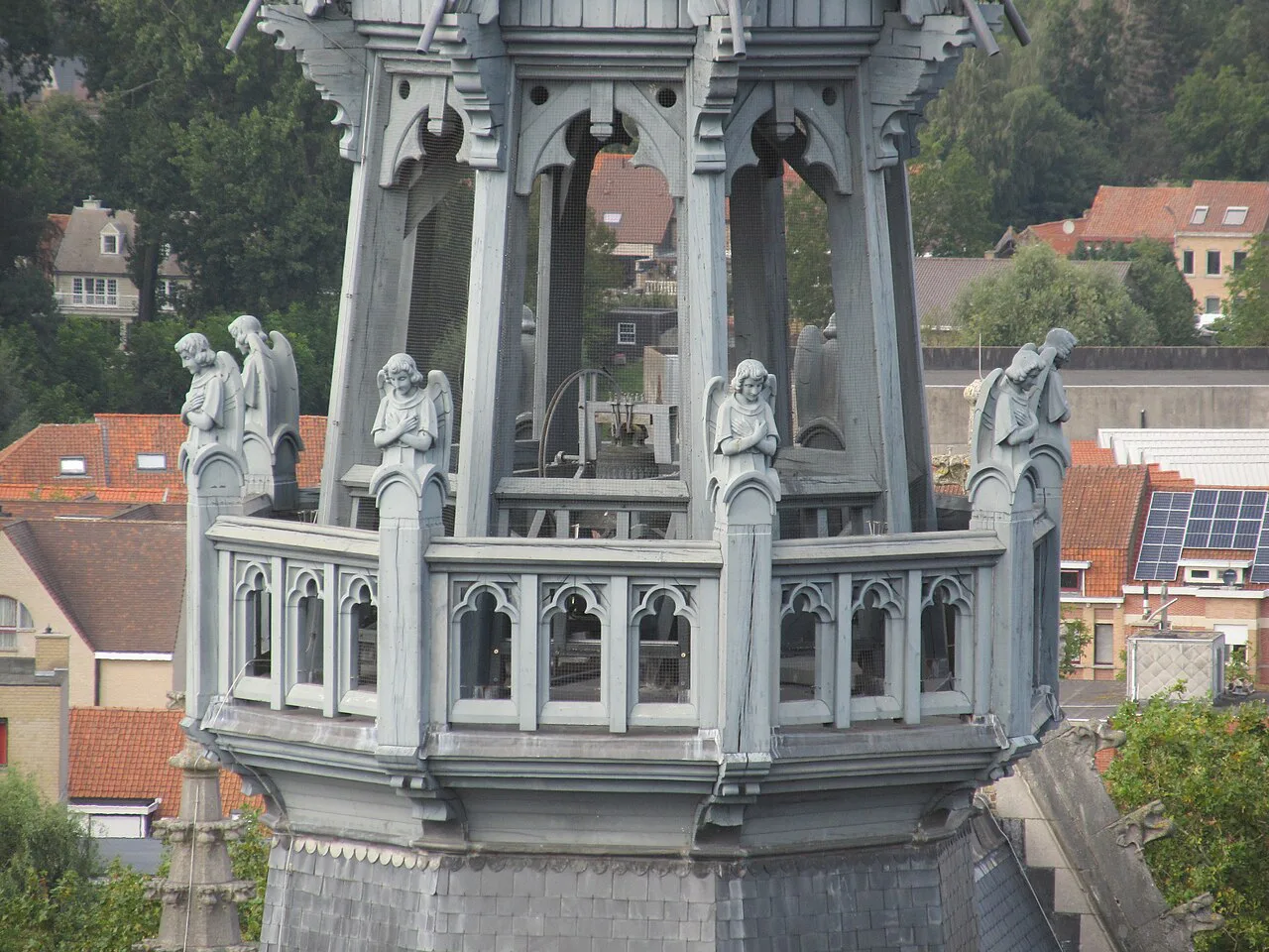 A pinnacle of St Martin's Cathedral above the rooftops of Ypres.