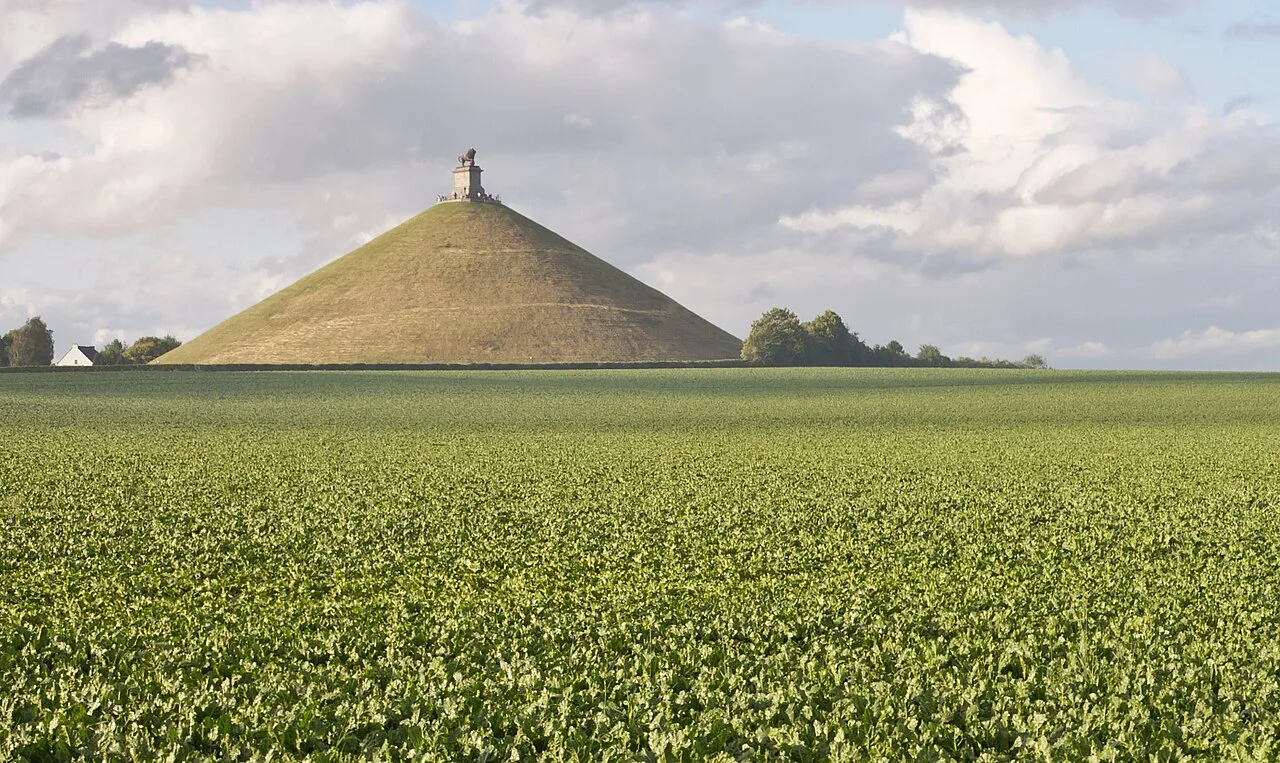 The Lion's Mound rising above the fields of the Waterloo battlefield.