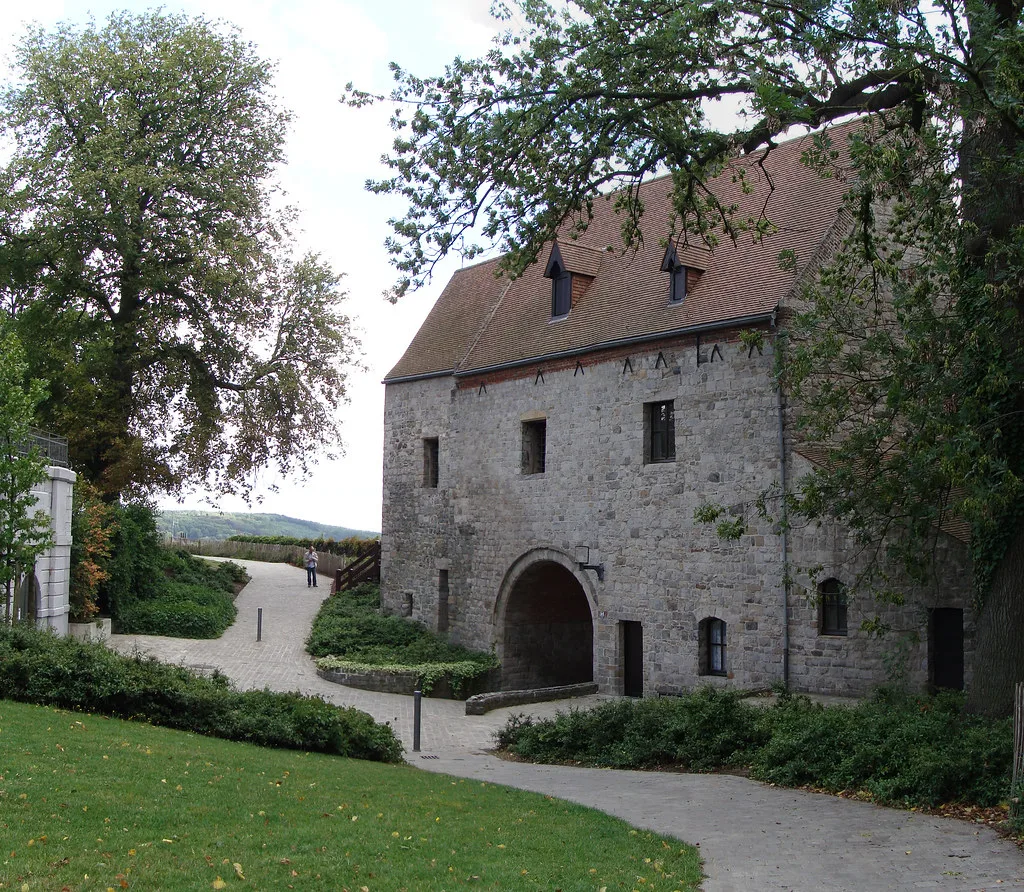 A stone building in the Jardin du Beffroi, the garden around the Mons belfry.