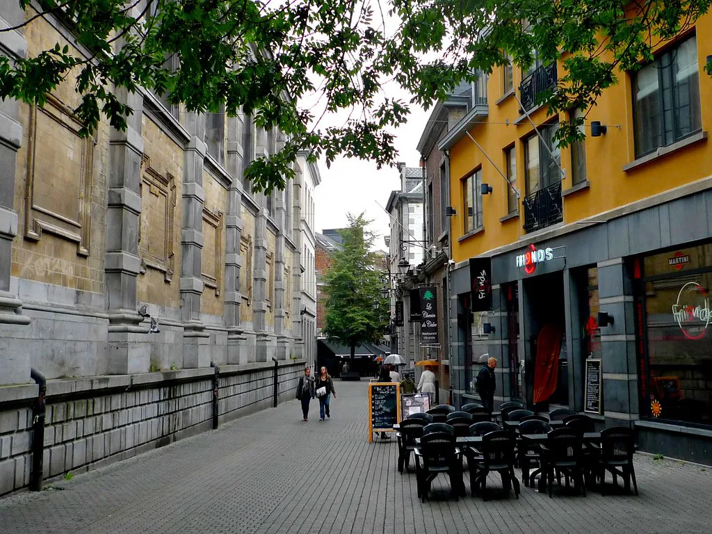 A quiet street with café terraces in Namur.
