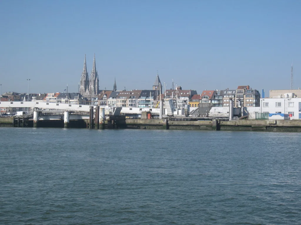 The spires of St Peter and St Paul's Church on the Ostend skyline across the harbour.