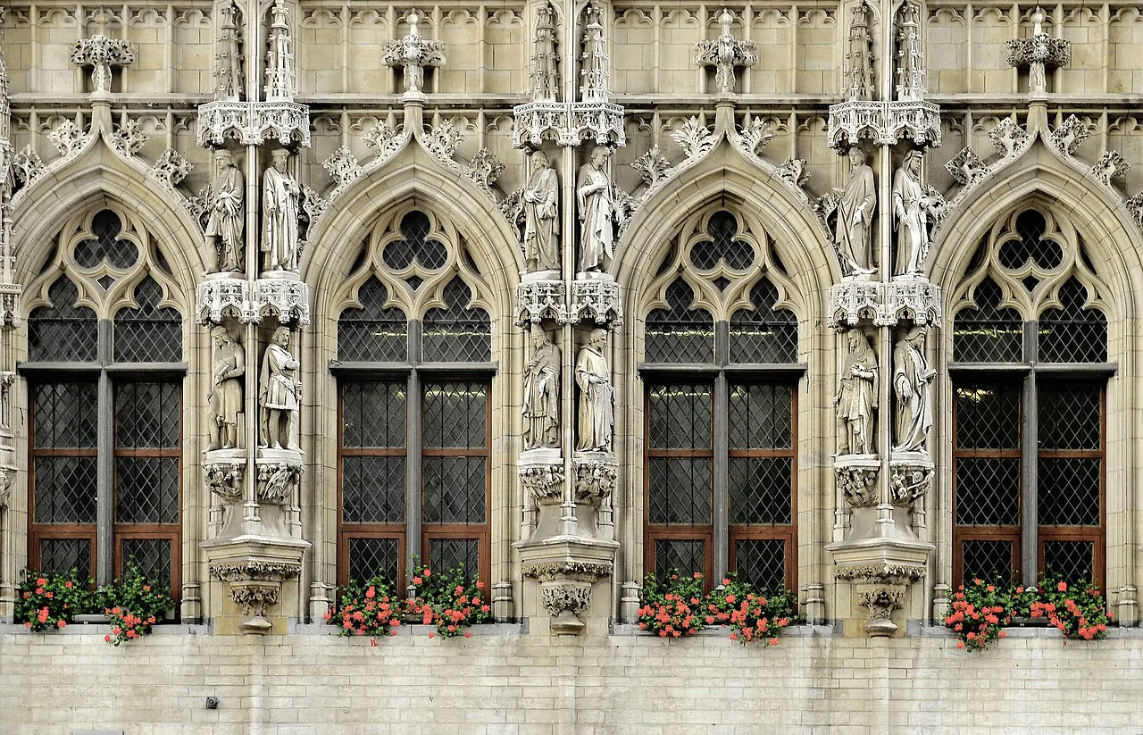 Detail of the Gothic Town Hall façade with its sculpted niches, Leuven.