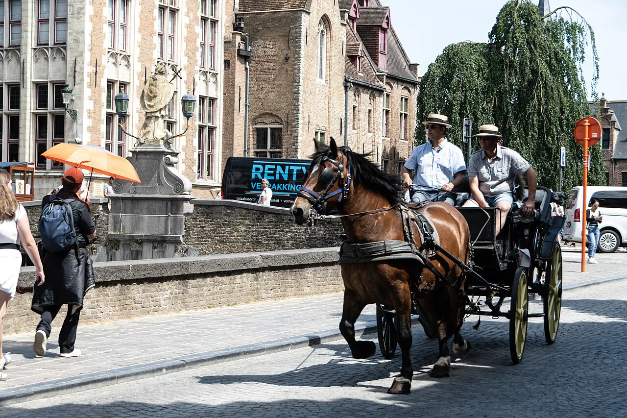 A horse-drawn carriage on the Rozenhoedkaai, Bruges.