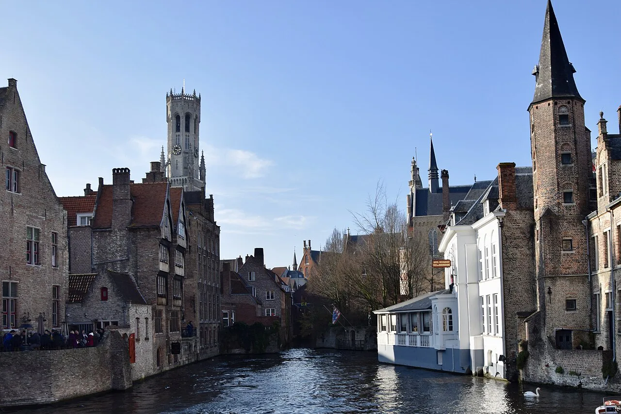 The Rozenhoedkaai canal with the Belfry of Bruges behind.