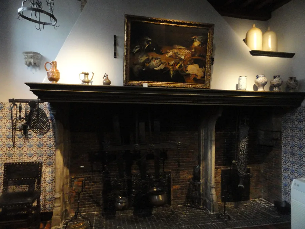 A furnished room with a painting above the fireplace in the Rubens House in Antwerp.