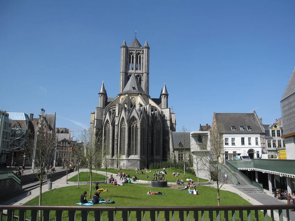 Saint Nicholas' Church beyond a lawn in central Ghent.