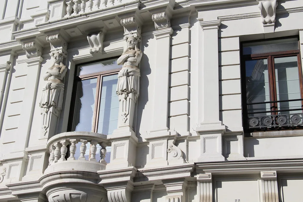 Caryatids on an ornate facade in Drukkerijstraat in Antwerp's Sint-Andries quarter.