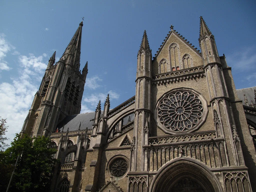 The Gothic tower and rose window of St Martin's Cathedral in Ypres.