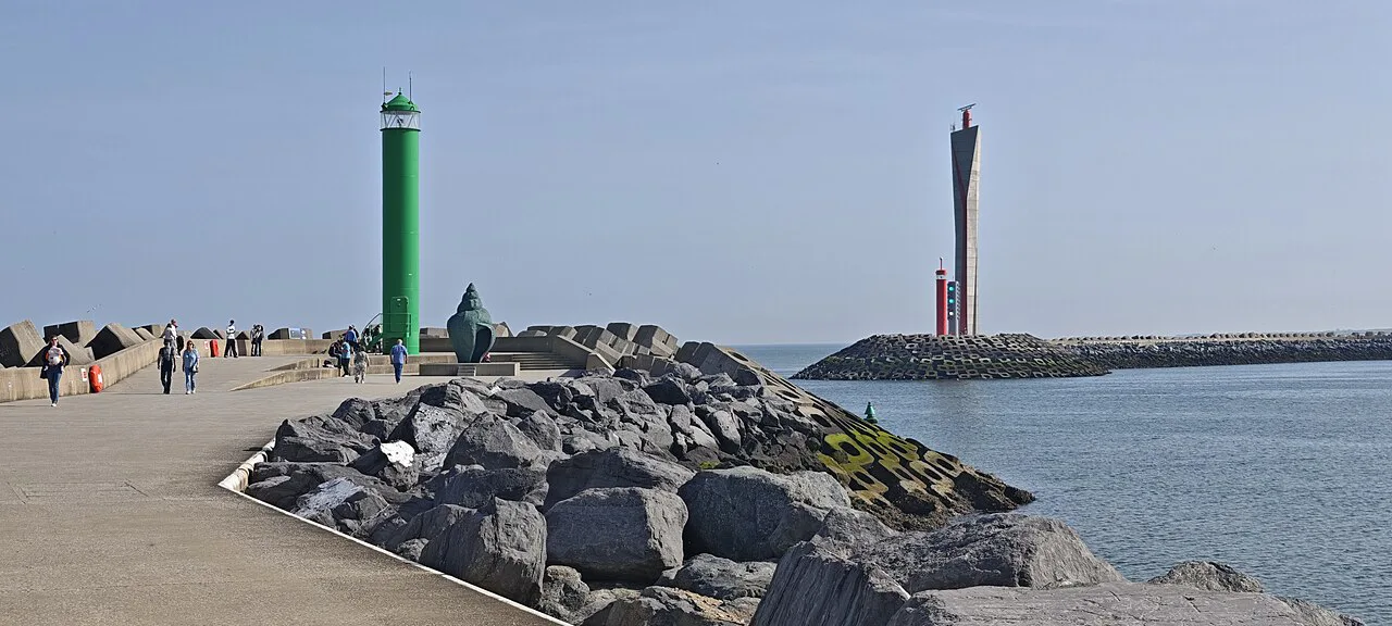 The harbour lighthouse and radar tower at the end of the western breakwater in Ostend.