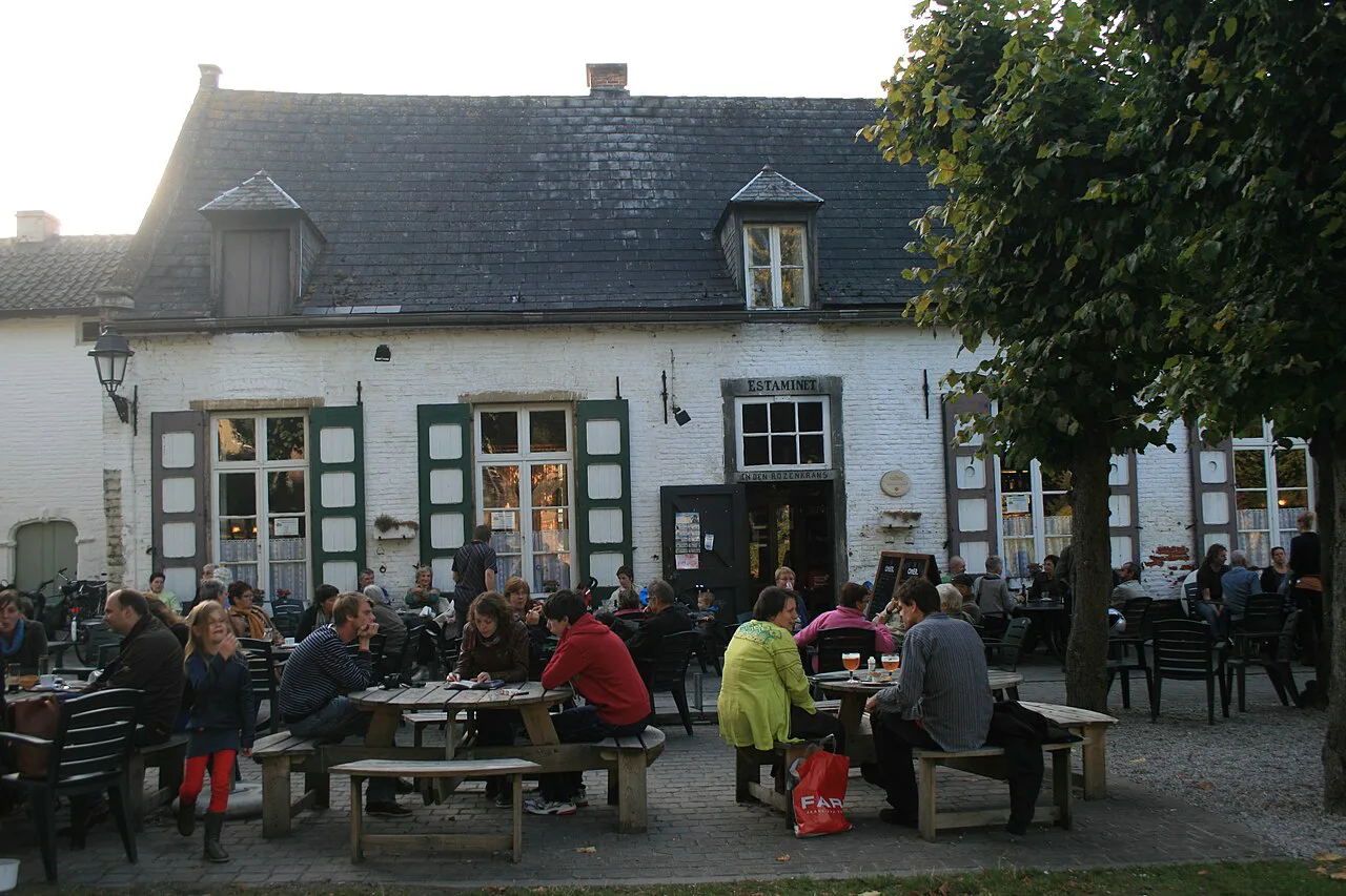 Visitors on a café terrace at Vlierbeek Abbey in Kessel-Lo, Leuven.