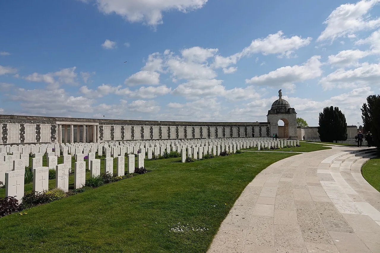 Rows of headstones beside the memorial wall at Tyne Cot Cemetery, Zonnebeke.
