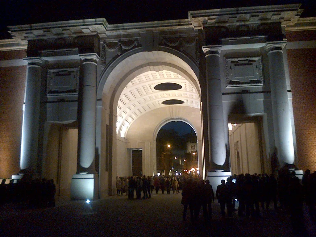 Visitors gathered under the Menin Gate at night, Ypres.