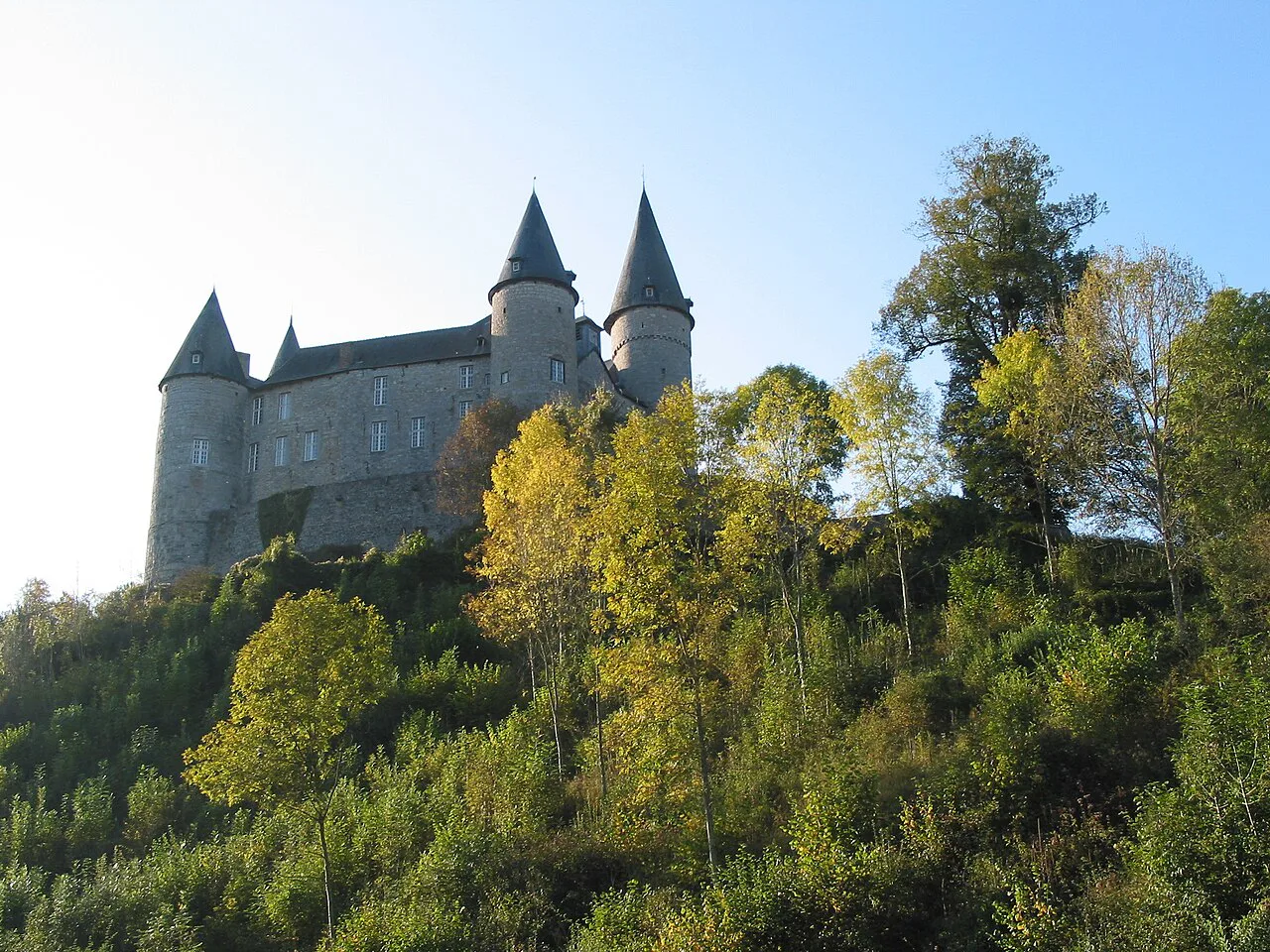 Château de Vêves on its wooded hill, Vêves, Houyet.