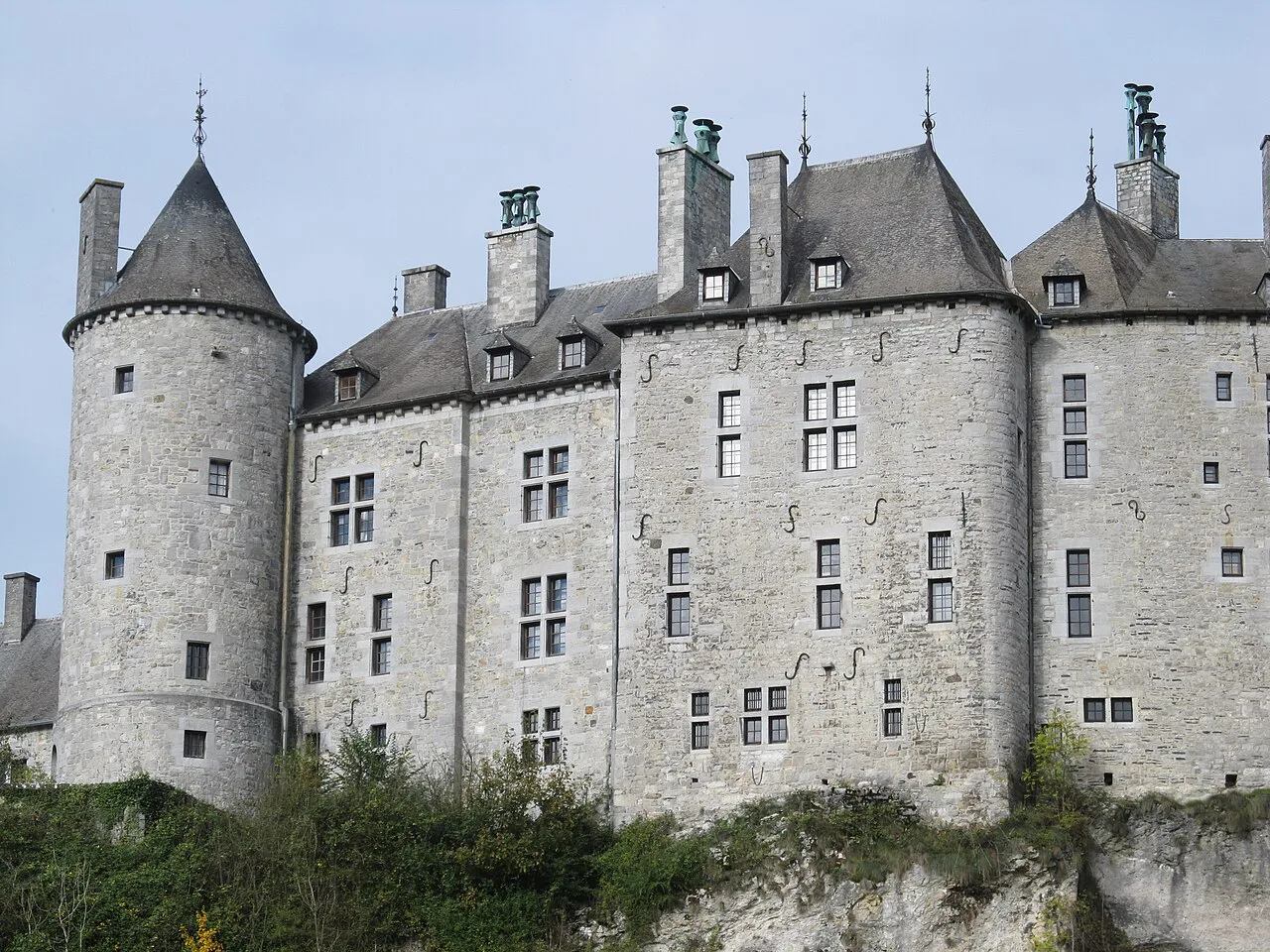 The turrets and stone façades of Walzin Castle above its cliff, Walzin.