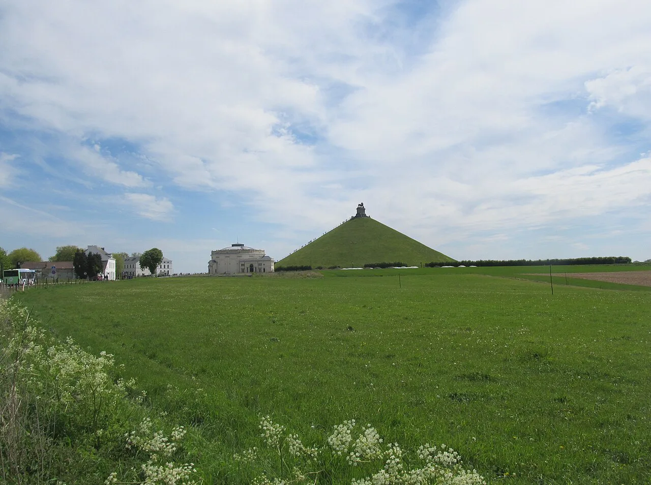 The Lion's Mound rising above the fields of the Waterloo battlefield.